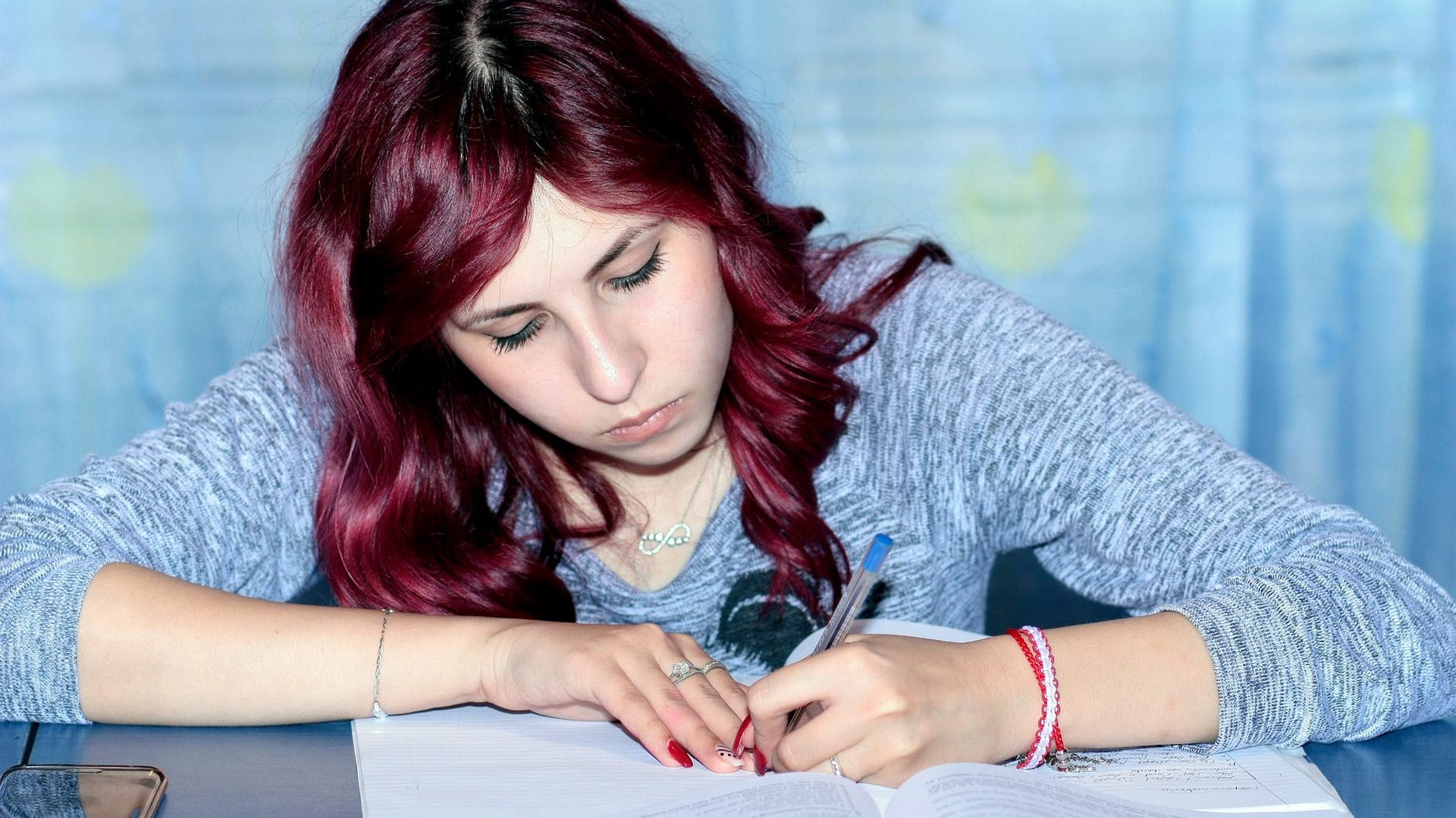 girl writing exam paper